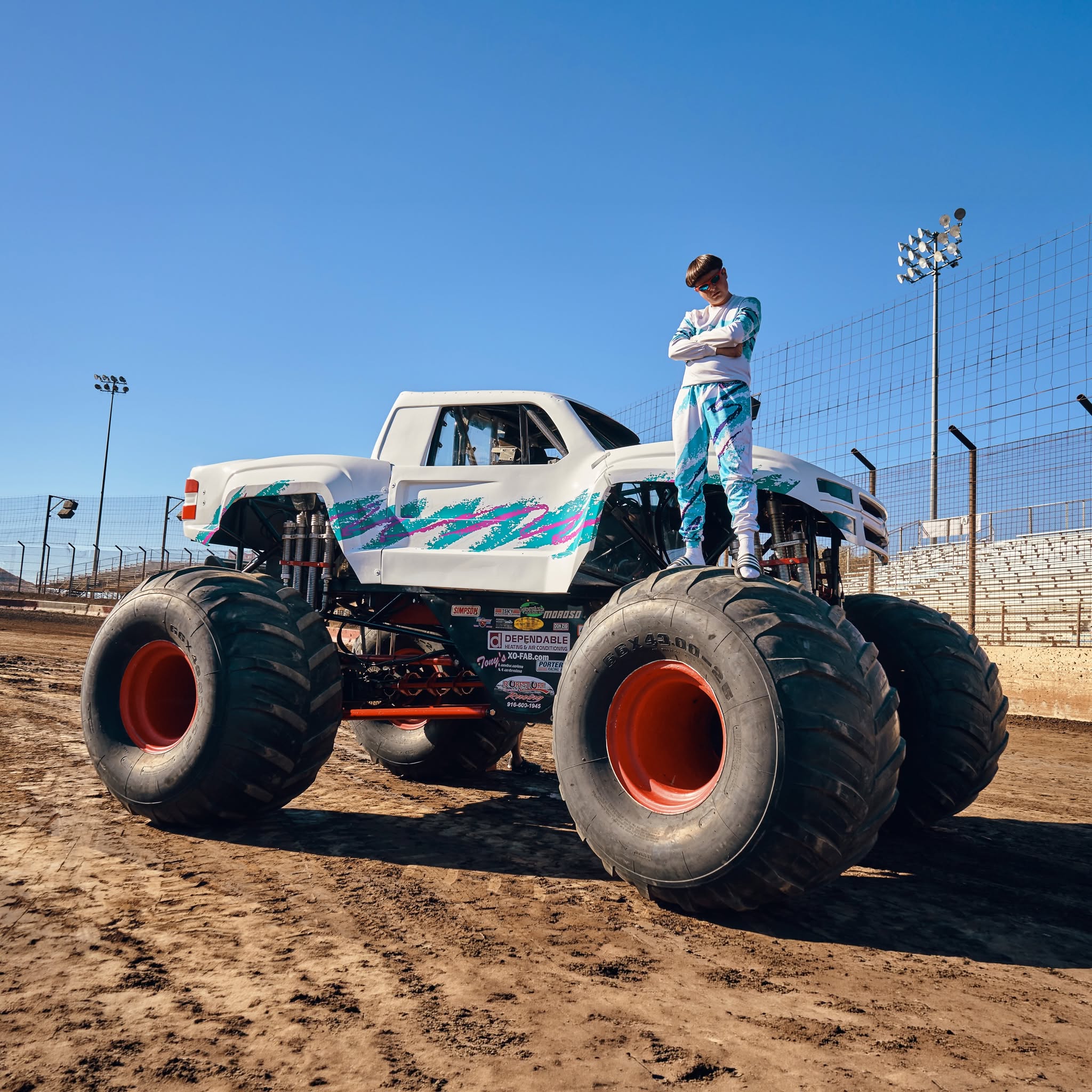 Oliver Tree standing on a monster truck